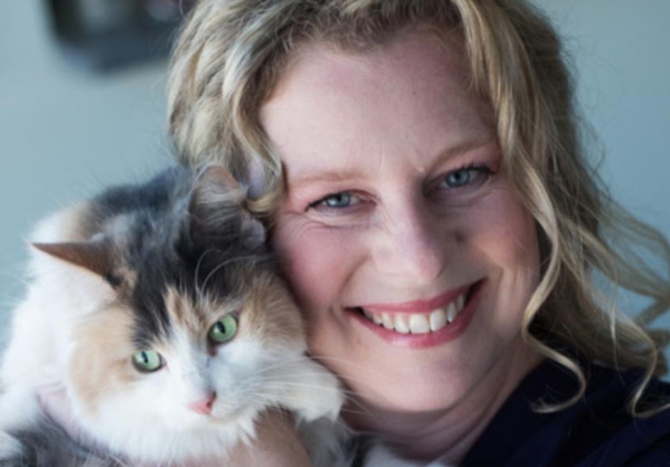 Woman smiling with cat